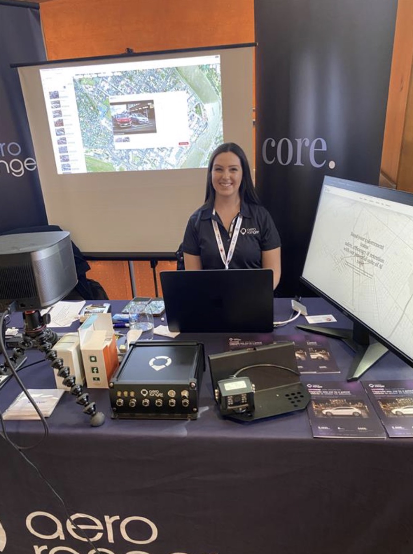 Aero Ranger team member at the South Australian LGAPA exhibition stand with hardware and demo screens