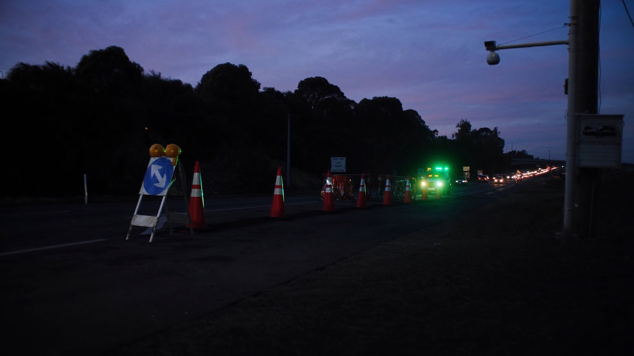 Australian temporary roadworks site with traffic-control equipment and lane controls