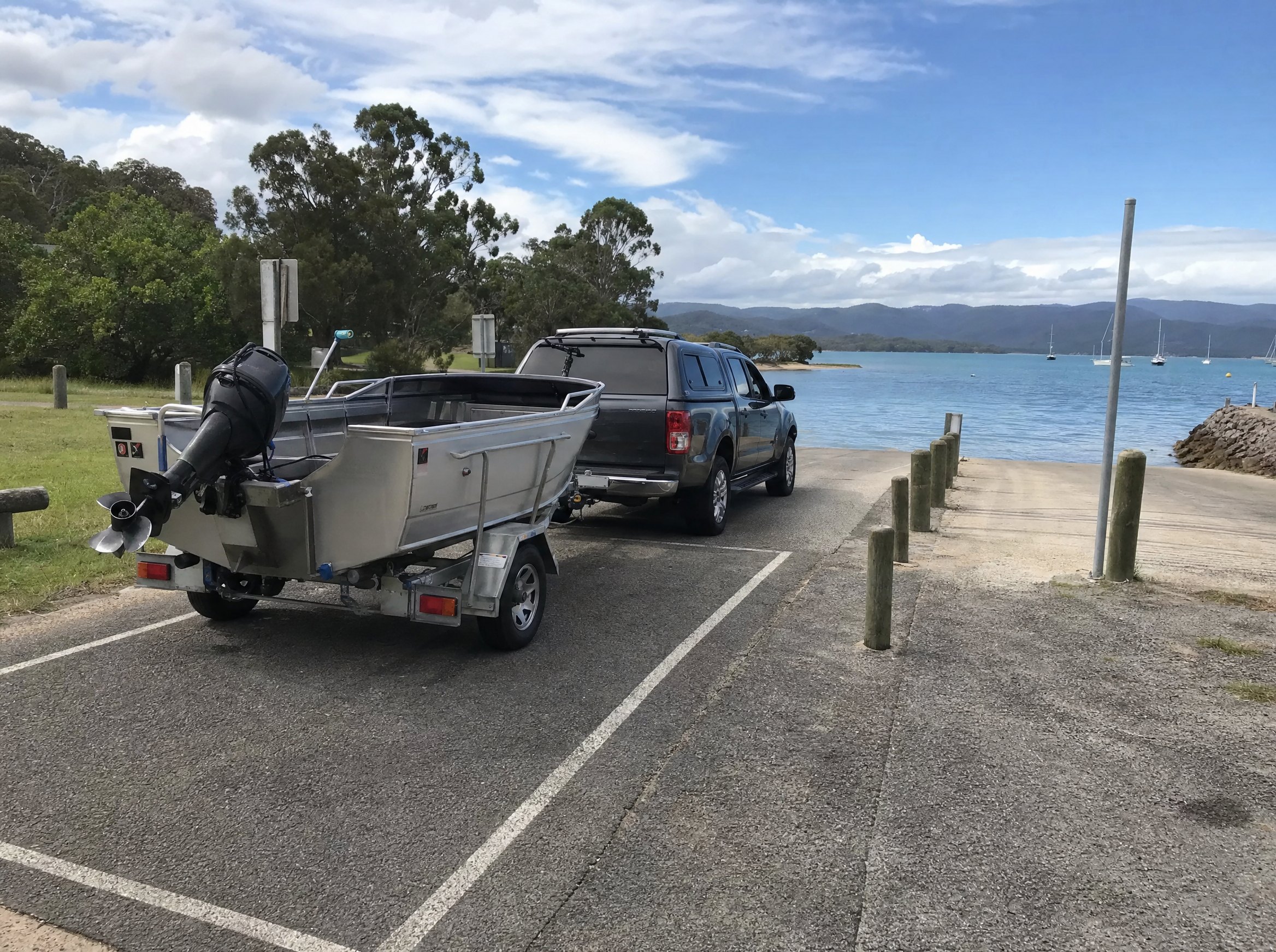 Boat trailer at a foreshore ramp with permit area context